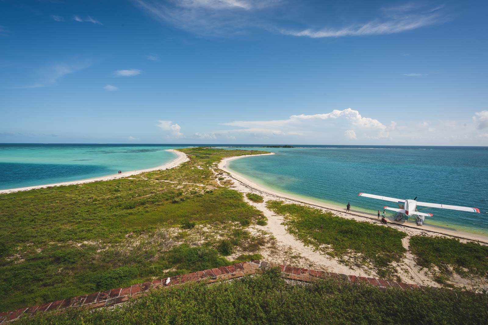An aerial view of the historic Fort Jefferson surrounded by clear turquoise water in Dry Tortugas National Park.