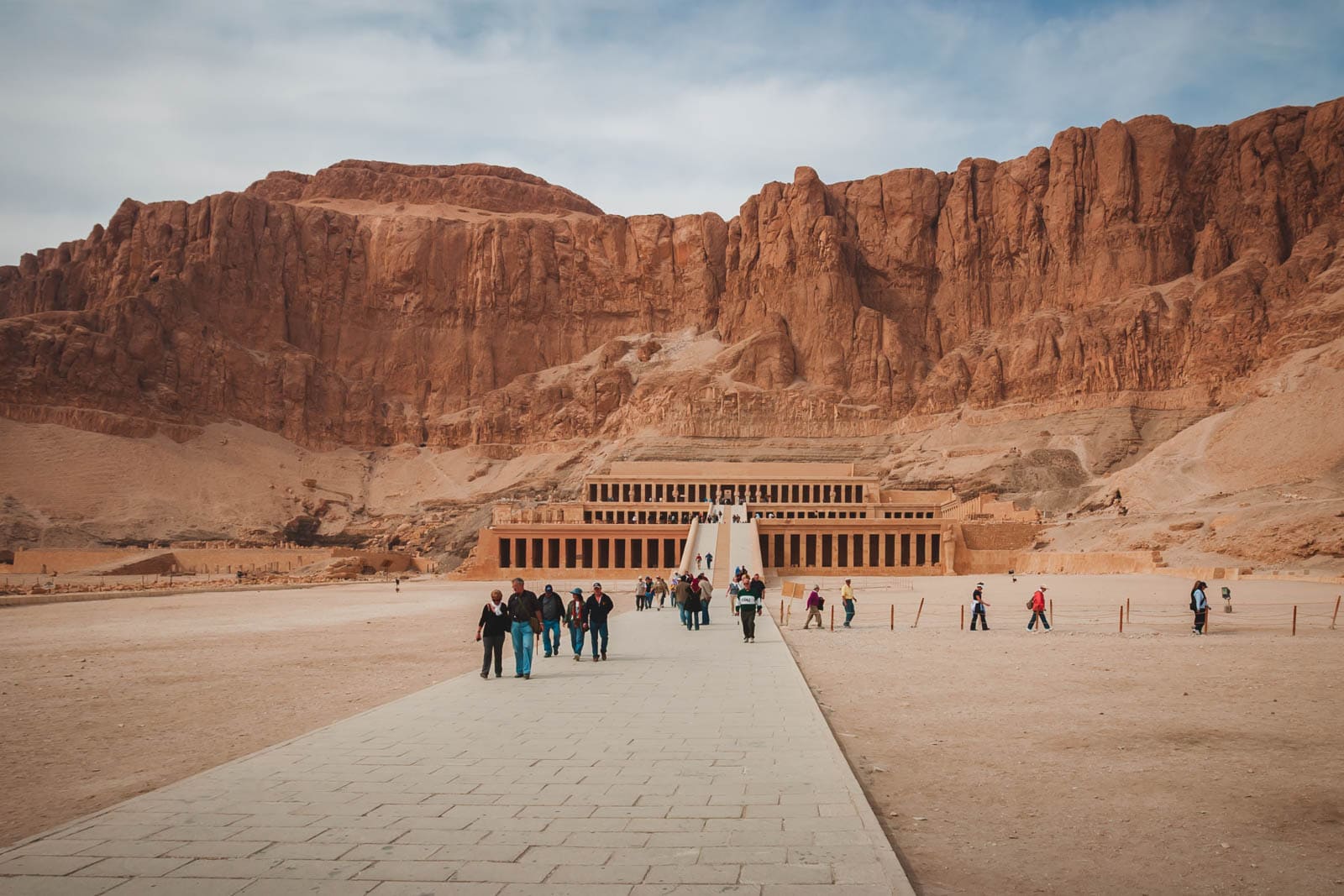 Tourusts walking at the Temple Of Luxor representing a positive and safe tourist interaction.