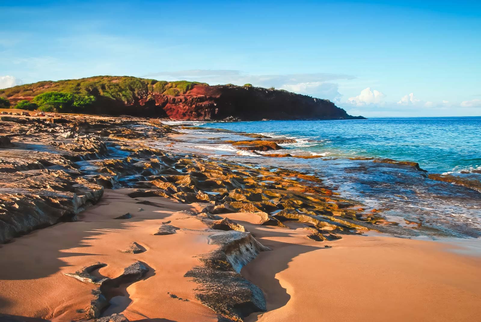 The empty stretch of golden sand at Kepuhi Beach on the island of Molokai, Hawaii