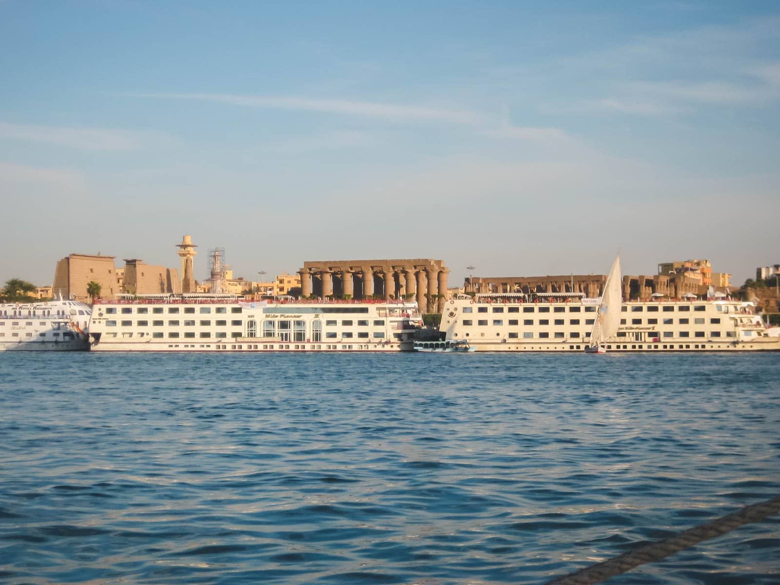 a Nile cruise ship sailing between Luxor and Aswan, a popular and safe way to travel for families and couples.