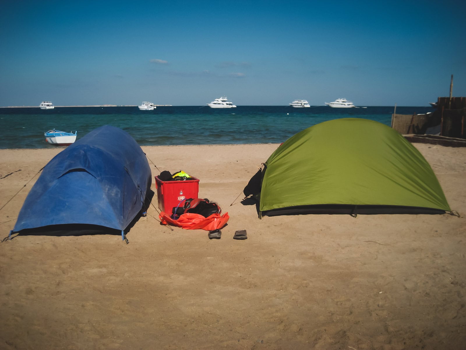 A relaxing view of a the beach in Sharm el-Sheikh with clear blue water, showing the secure and peaceful scene.