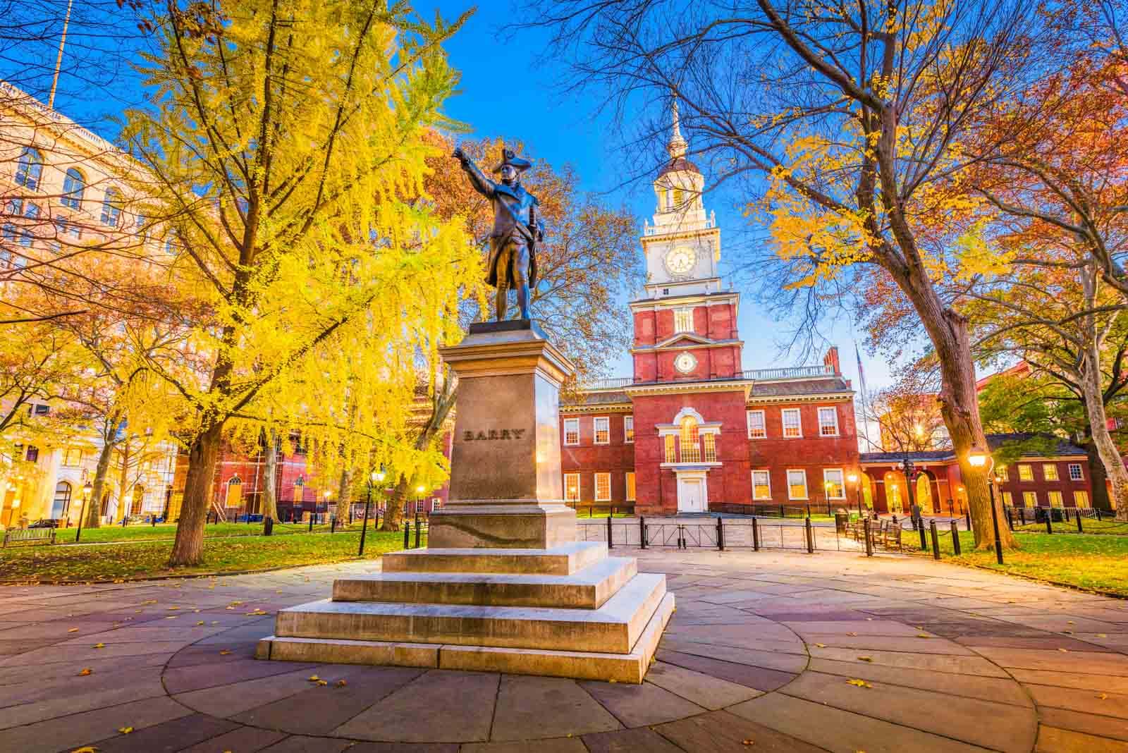 A view of Independence Hall in Philadelphia, Pennsylvania, on a cool fall day with golden trees